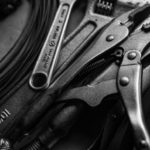 Wrenches and pliers in black and white